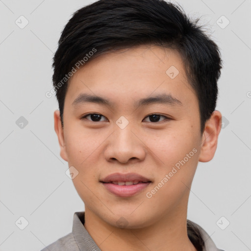 Joyful asian young-adult male with short  brown hair and brown eyes