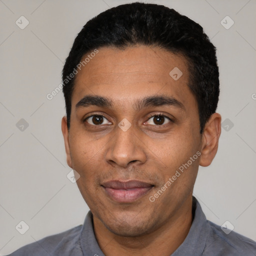 Joyful latino young-adult male with short  black hair and brown eyes