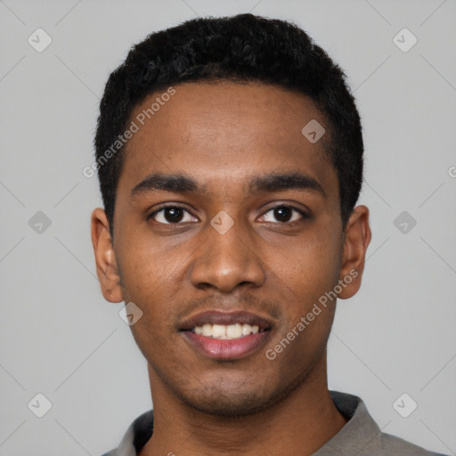 Joyful black young-adult male with short  black hair and brown eyes
