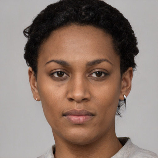Neutral black young-adult female with short  black hair and brown eyes