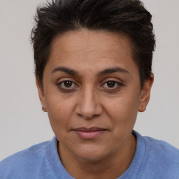 Joyful white adult female with short  brown hair and brown eyes