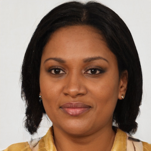 Joyful black young-adult female with medium  black hair and brown eyes