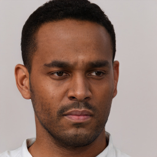 Neutral black young-adult male with short  brown hair and brown eyes