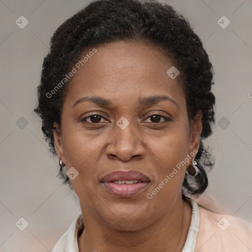 Joyful black adult female with short  brown hair and brown eyes