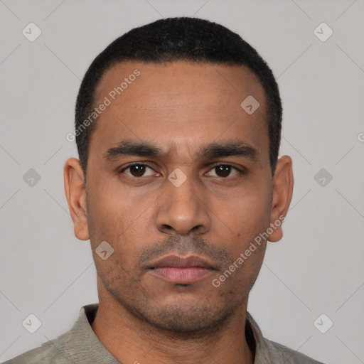 Neutral latino young-adult male with short  black hair and brown eyes