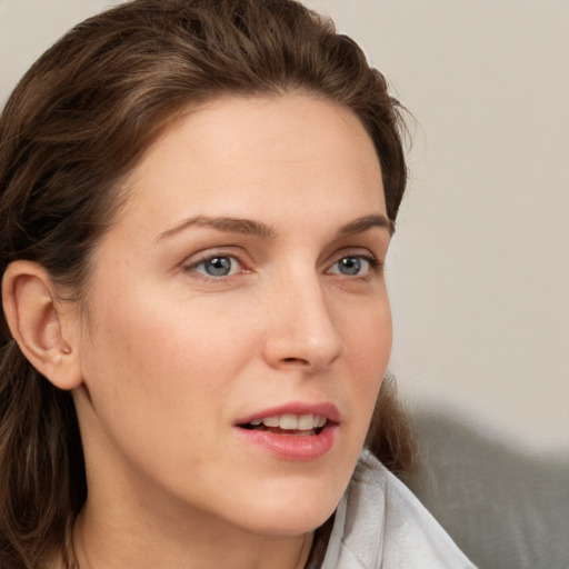 Neutral white young-adult female with long  brown hair and grey eyes