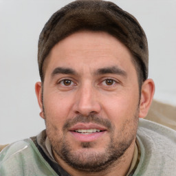 Joyful white young-adult male with short  brown hair and brown eyes