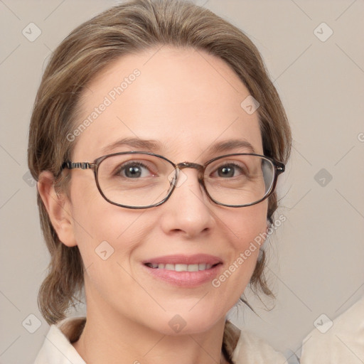 Joyful white adult female with medium  brown hair and blue eyes