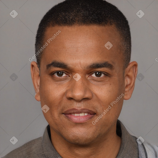 Joyful latino young-adult male with short  brown hair and brown eyes