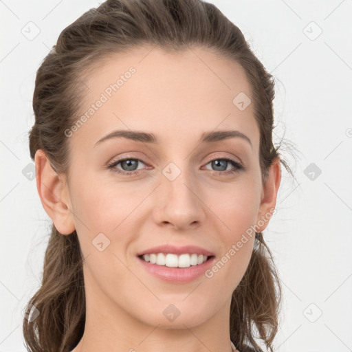 Joyful white young-adult female with long  brown hair and grey eyes