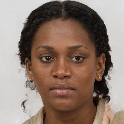 Neutral black young-adult female with short  brown hair and brown eyes