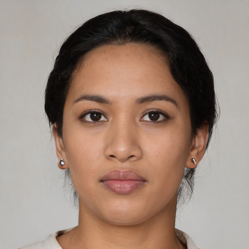 Neutral latino young-adult female with medium  black hair and brown eyes