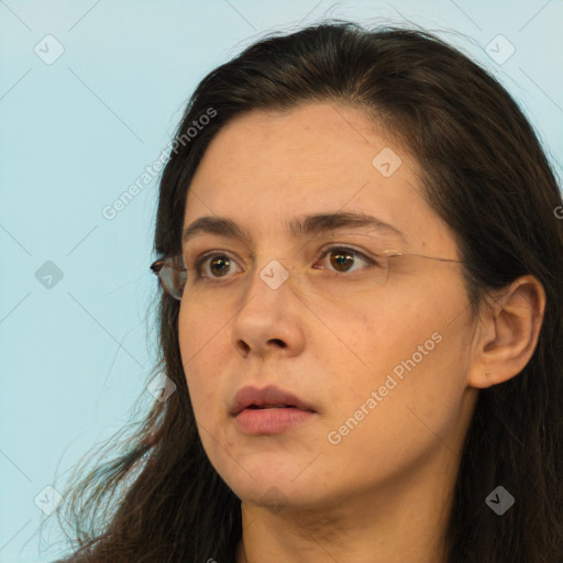 Neutral white young-adult female with long  brown hair and brown eyes