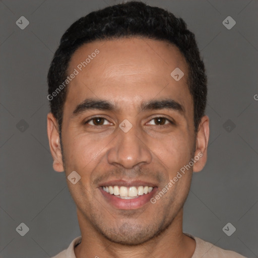 Joyful white young-adult male with short  black hair and brown eyes