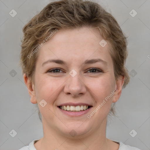 Joyful white young-adult female with short  brown hair and brown eyes