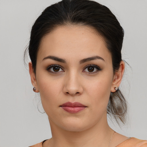 Joyful white young-adult female with medium  brown hair and brown eyes