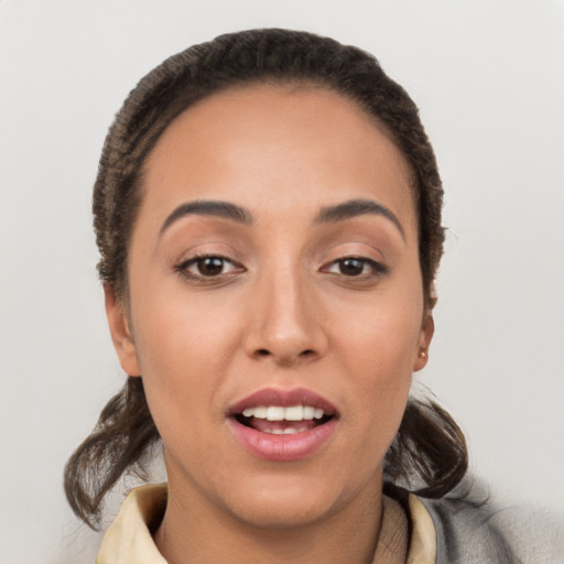 Joyful white young-adult female with short  brown hair and brown eyes