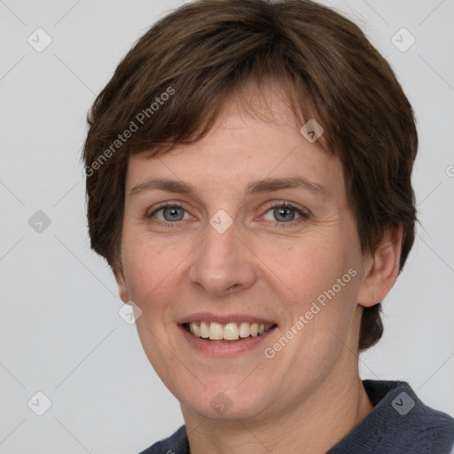 Joyful white adult female with medium  brown hair and grey eyes