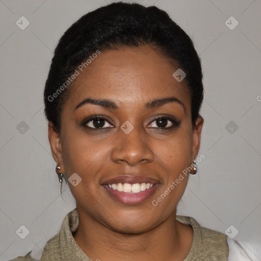 Joyful black young-adult female with short  black hair and brown eyes