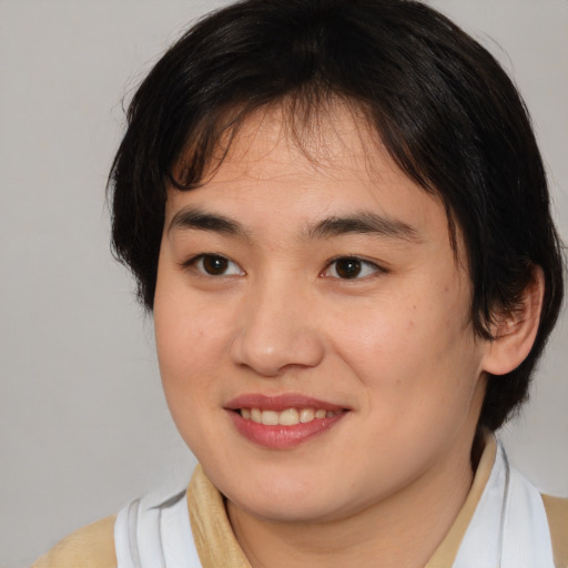 Joyful asian young-adult female with medium  brown hair and brown eyes