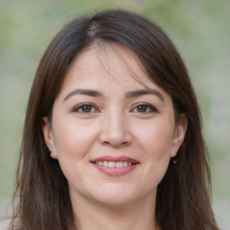 Joyful white young-adult female with medium  brown hair and brown eyes