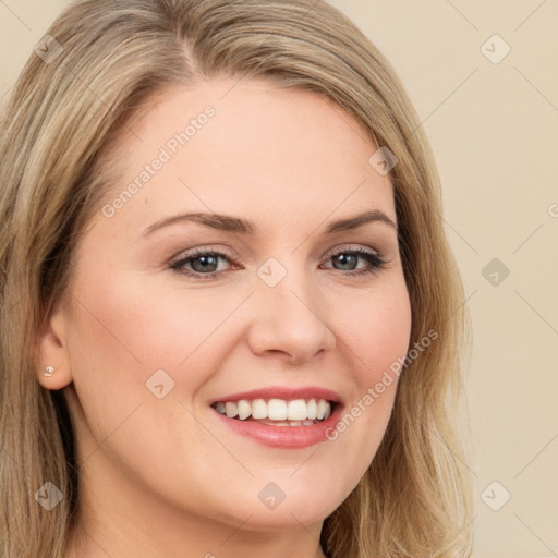 Joyful white young-adult female with long  brown hair and green eyes