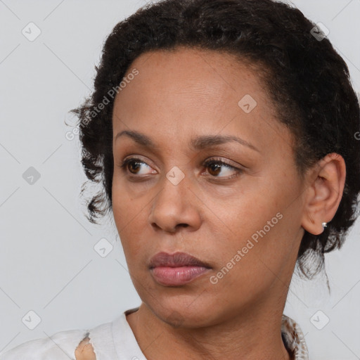 Neutral black adult female with short  brown hair and brown eyes