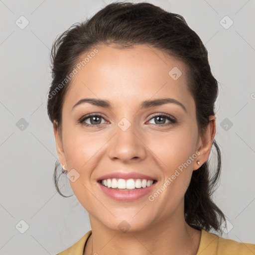 Joyful white young-adult female with medium  brown hair and grey eyes