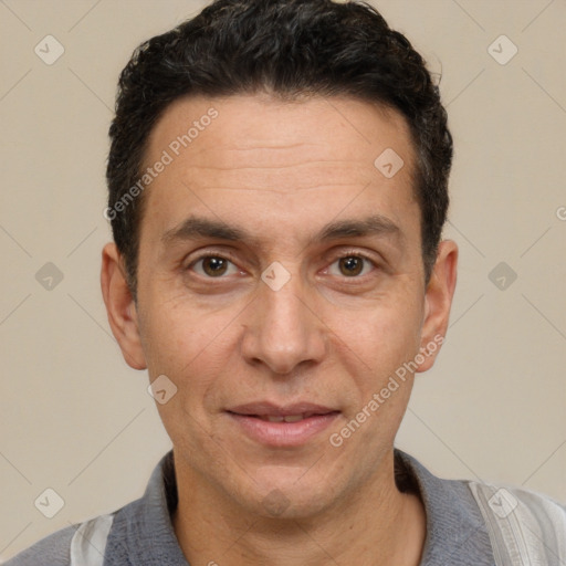 Joyful white adult male with short  black hair and brown eyes