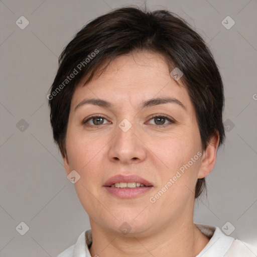 Joyful white adult female with short  brown hair and brown eyes