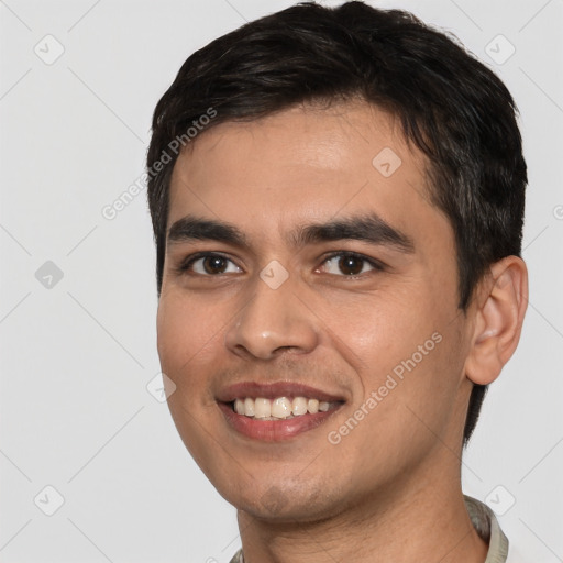 Joyful white young-adult male with short  black hair and brown eyes