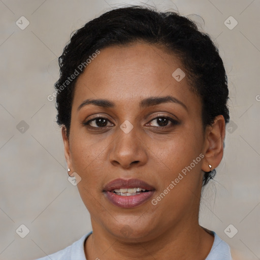 Joyful latino adult female with short  brown hair and brown eyes