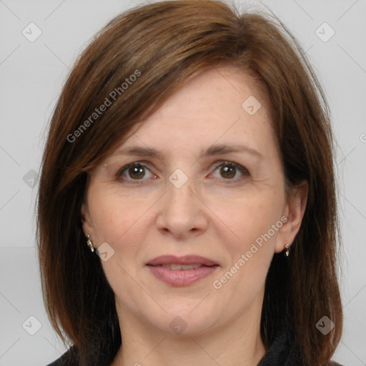 Joyful white adult female with medium  brown hair and brown eyes