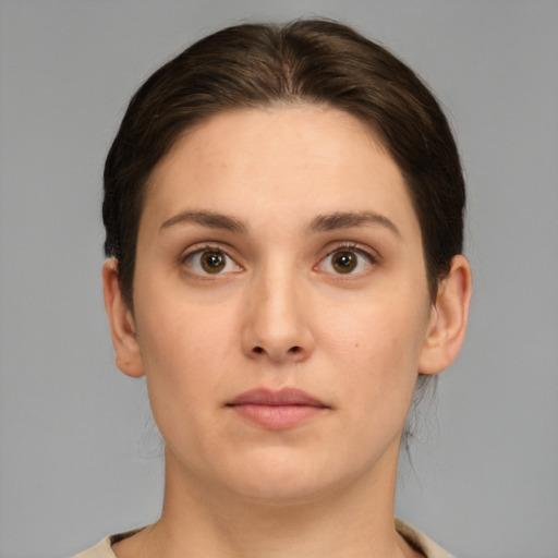 Neutral white young-adult female with medium  brown hair and brown eyes