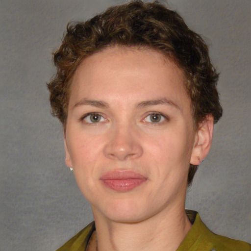 Joyful white young-adult female with short  brown hair and green eyes