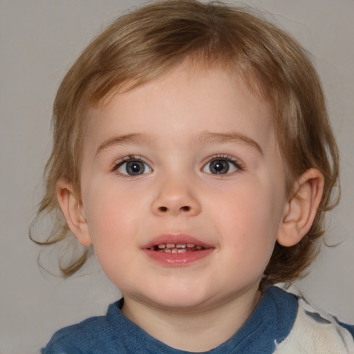 Joyful white child male with medium  brown hair and blue eyes