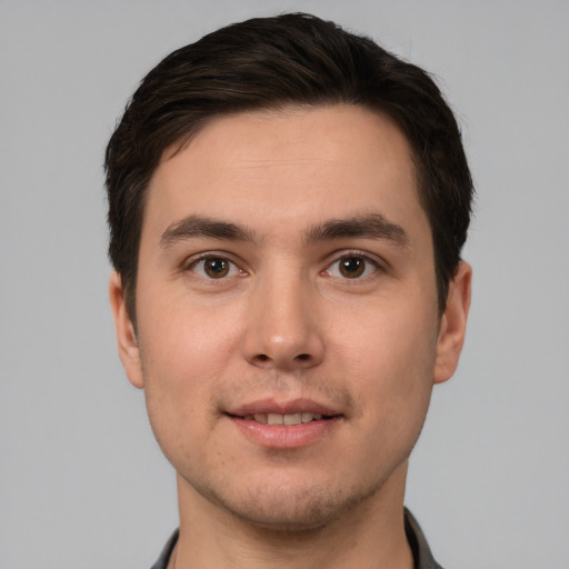 Joyful white young-adult male with short  brown hair and brown eyes