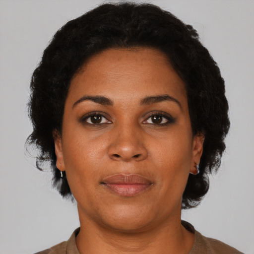 Neutral black young-adult female with short  black hair and brown eyes