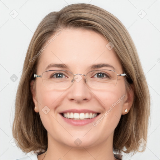 Joyful white adult female with medium  brown hair and blue eyes