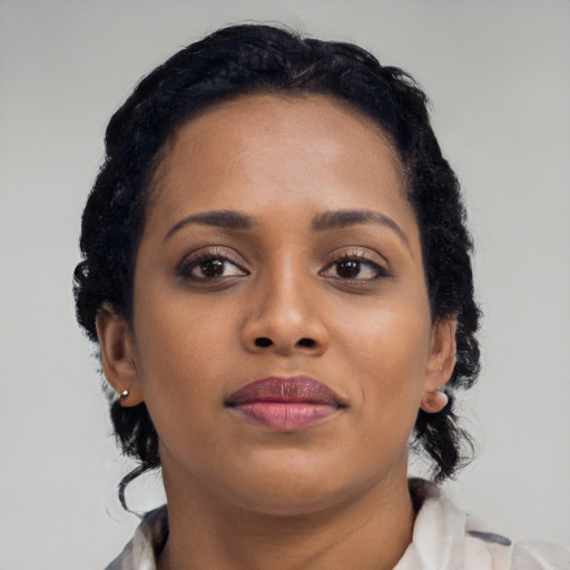 Neutral black young-adult female with medium  black hair and brown eyes