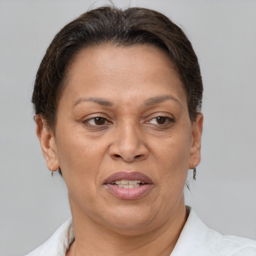 Joyful white adult female with short  brown hair and brown eyes