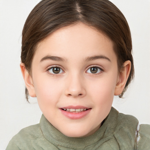 Joyful white child female with medium  brown hair and green eyes