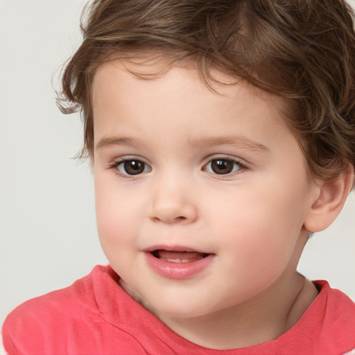 Joyful white child female with short  brown hair and brown eyes