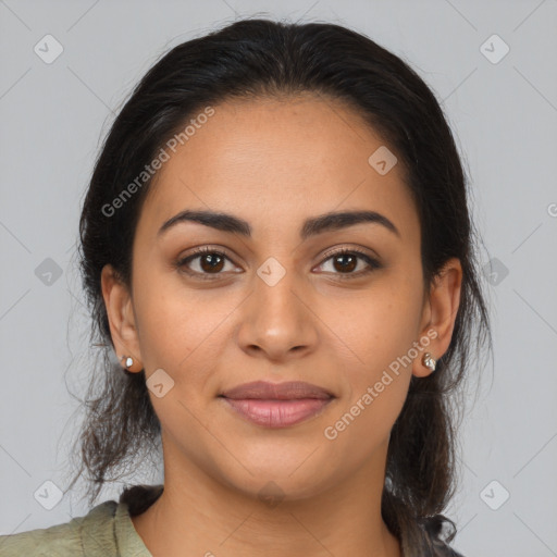 Joyful latino young-adult female with long  brown hair and brown eyes