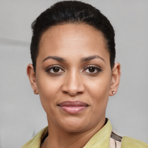 Joyful latino young-adult female with short  brown hair and brown eyes