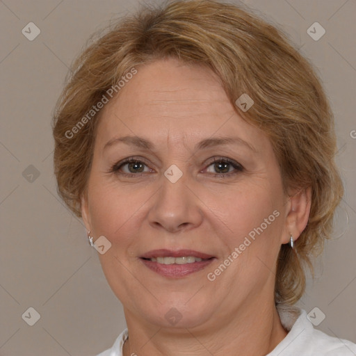 Joyful white adult female with medium  brown hair and brown eyes