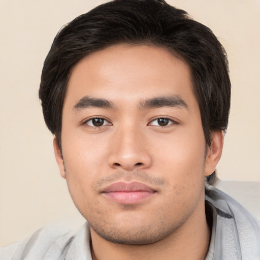 Neutral asian young-adult male with short  brown hair and brown eyes