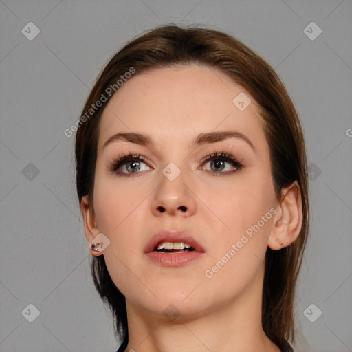 Neutral white young-adult female with medium  brown hair and brown eyes