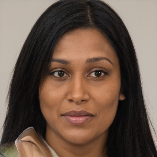 Joyful asian young-adult female with long  black hair and brown eyes