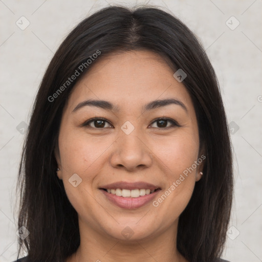 Joyful latino young-adult female with long  brown hair and brown eyes